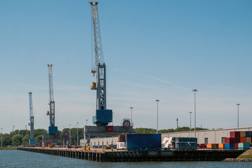 Obraz premium Port of Rotterdam, Netherlands. Cargo ships and cranes loading, Logistics business