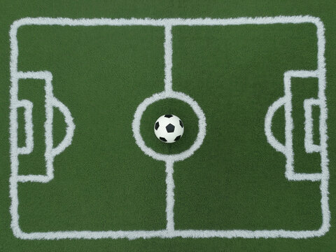 A Top-Down View of a Soccer Field Miniature Layout with White Chalk Markings and a Ball Placed at Center Circle on Green Turf