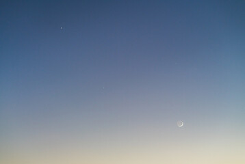 Astrophotography of spectacular celestial conjunction with crescent moon and three planets © Hector
