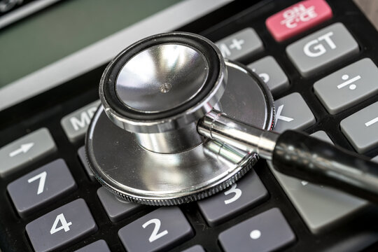 Stethoscope, calculator - health care costs concept