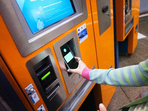 Person paying for subway ticket using phone Bucharest