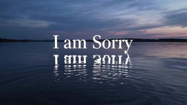 Serene lake at dusk with the words "I am Sorry" reflected on the water's surface.