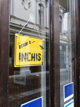 Shop window displaying closed sign in Bucharest