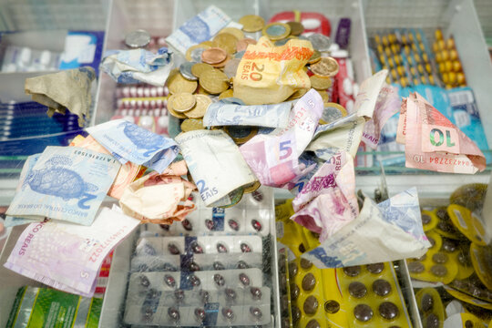 Money and Medication Seen in a pharmacy