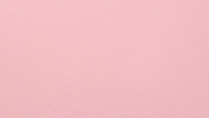 Fototapeta premium Pink textured paper background with subtle grain for minimalist design