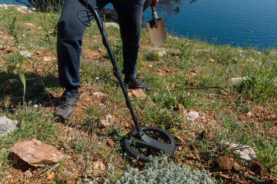 Man with metal detector exploring the surroundings