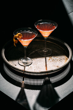 Two cocktails in martini glasses 