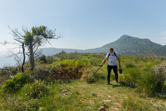 Man and metal detector