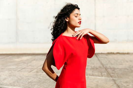 Woman posing in red fashion dress 