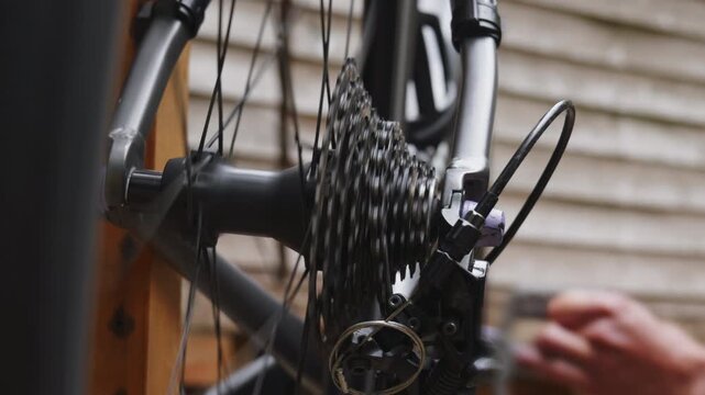 Macro shot of metallic bicycle rear sprocket gears and chain mechanism