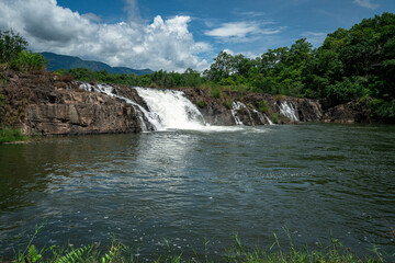 Close-up of cascading water over ancient rock formations at Tad Faek Waterfall, Sekong Province, Laos © jr