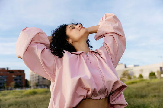 Woman with closed eyes looking up