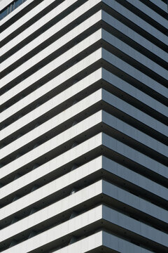 Modern building corner with geometric line pattern