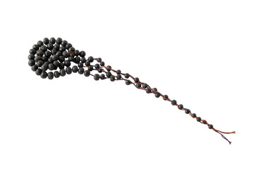 Fototapeta premium A close-up shot of a long, thin, dark brown beaded necklace with a looped cluster of beads on a white surface.