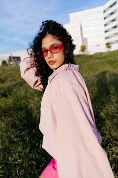 Woman wearing pink sunglasses 