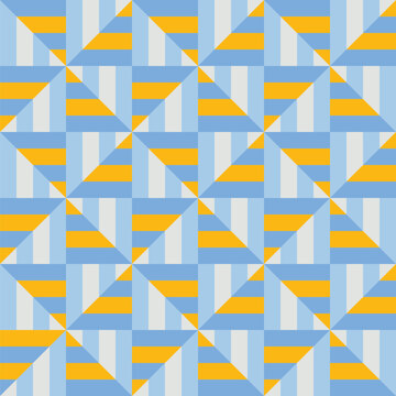 Seamless windmill pattern created from blue and yellow triangles on a pale blue and white striped background