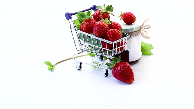 strawberries in small grocery trolley with white background