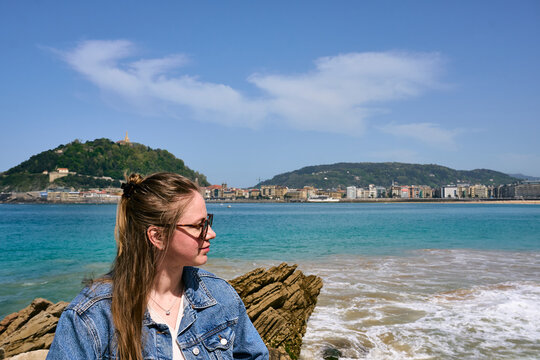 Happy blonde woman near the sea