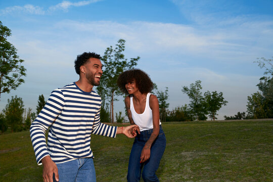 Playful couple at sunset light