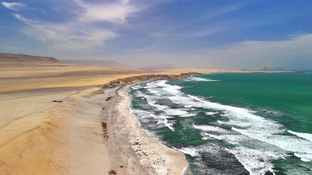 Aerial drone view of the Pacific Ocean and cliffs in Paracas. Dramatic Pacific landscape. Panoramic coastal view. Peru. Region Ica.	