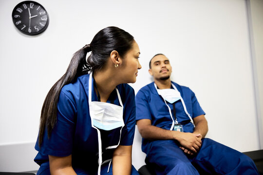 Doctors Talk in a Hospital Room During a Shift