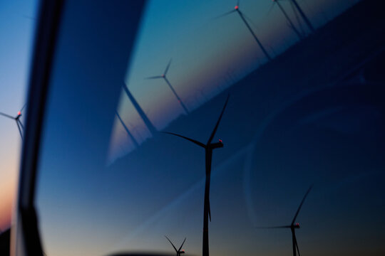 abstract reflections of wind park at dusk