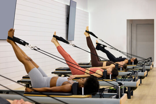 Group is Exercising in a Fitness Studio With Machines