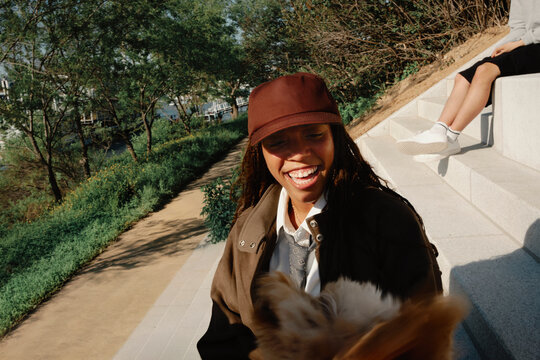 Young woman smiling outdoors near Hangang River
