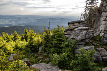 Fototapeta premium Granite rock formations at Dreisessel in the Bavarian Forest under dramatic evening clouds