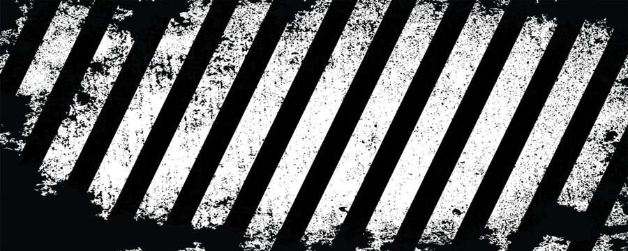 Industrial monochrome background featuring a heavy distressed grunge texture over black and white diagonal hazard warning stripes.