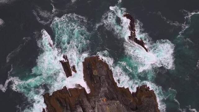 Kerry Cliffs at Cloudy weather Aerial Shot. Dramatic Rocks on the West Ocean Coast in Kerry County, Portmagee, Ireland