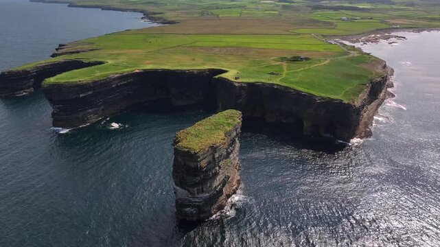 Downpatrick Head in Ireland at Sunny Day, Aerial Drone Shot. Stunning High Cliffs, Dun Briste Irish Coastal Landmark.