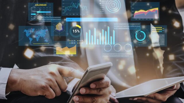 Business professional analyzing data on mobile device and tablet with futuristic digital interface showcasing charts, graphs, and world map for analytics and decision-making. Entropy.