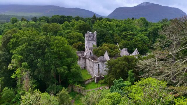 Muckross abbey ruins aerial view, hiking in Killarney national park in Ireland, Irish nature, drone shot of the lake and castle in Killarney national park, travel the Ring of Kerry in Ireland
