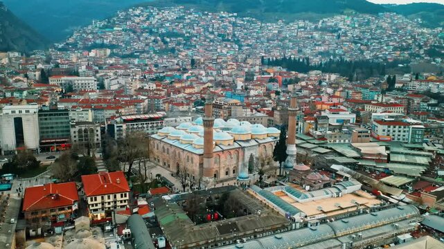 Bursa Ulu Cami mosque historical architecture captured from above with a drone flight. Aerial panoramic view of the grand landmark in Turkey.