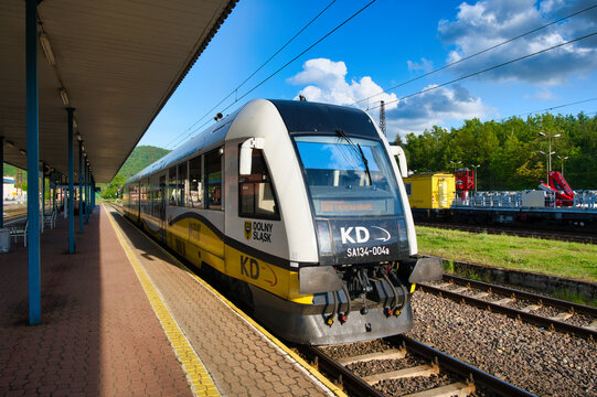 Regional Passenger Train KD at Outdoor Station Platform on Sunny Day in Wałbrzych