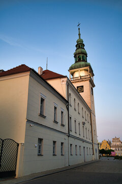 Historic Town Hall Clock Tower Over Quiet Cobblestone Street at Dusk With Blue Sky - City Of Bytom Odrzański.