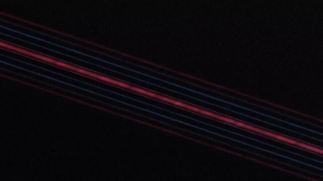 Abstract Light Lines Shimmering Across Dark Background