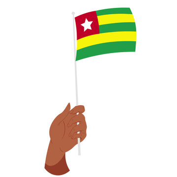 Hand holding togo flag on pole symbolizing national pride