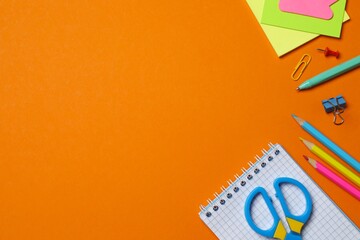 Back to school or office desk arrangement with vibrant stationery on orange background  © Sunlight