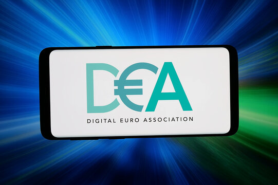 Stuttgart, Germany - 06-12-2026: In this photo illustration, the logo of think tank Digital Euro Association (DEA) is displayed on a smartphone in front of abstract background on computer screen.