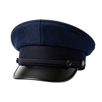 Close up of a dark blue chauffeur hat with a shiny black brim on white