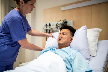 Fototapeta premium Nurse caring for hospital patient