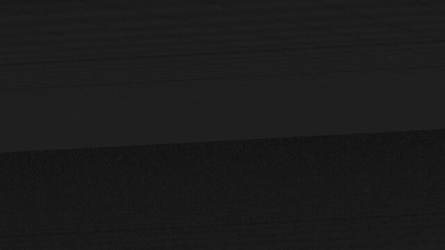 Abstract Dark Scene Shifting Shadows with Subtle Geometric Textures in Low Light