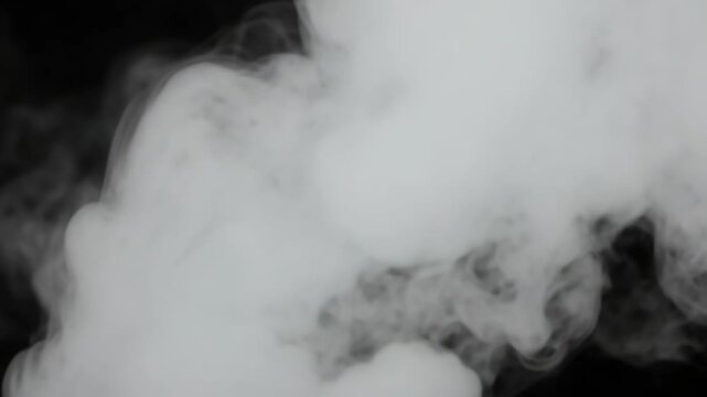 Vapor cloud forming in a dark space.