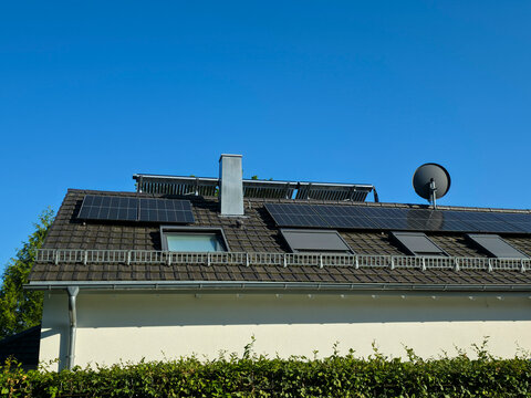 modern new house equipped with advanced pv modules delivering sustainable energy beneath crystal clear blue sky