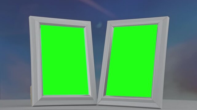 Two blank white picture frames with green screens for content replacement. The camera zooms out as the frames slowly separate on a table