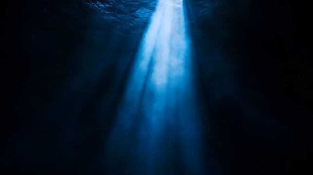 light rays of light on a dark blue background