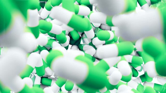 Green and white capsules falling and filling the screen. 3D animation of medical pills. Pharmacy and healthcare concept.