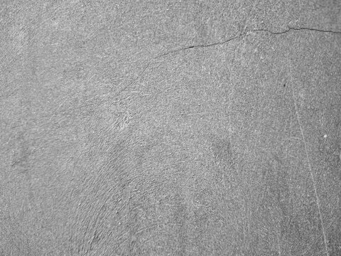 Minimalist Smooth Grey Cement Wall Texture Background with Fine Crack